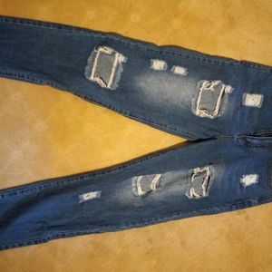 Ripped jeans. Dark and faded blue. Small.